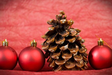 The cone and toys on a red background. christmas  styleの写真素材