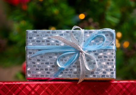 Gift decorated with a tape and a bow