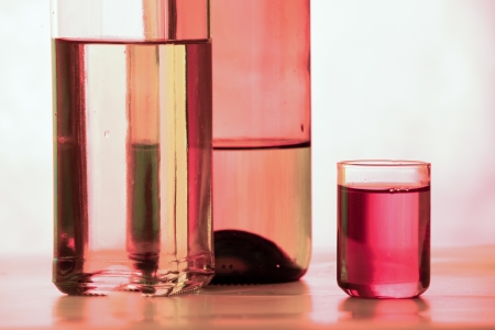 composition of the glass bottles illuminated by colored lightの写真素材