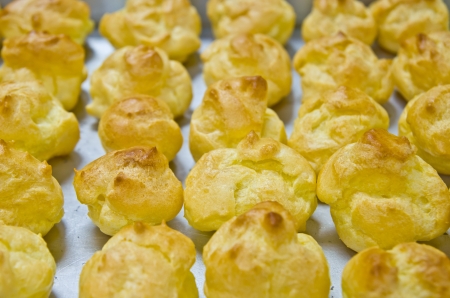 pastries in arow on a trayの写真素材
