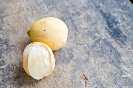 tropical fruit longkong on the wood backgroundの写真素材