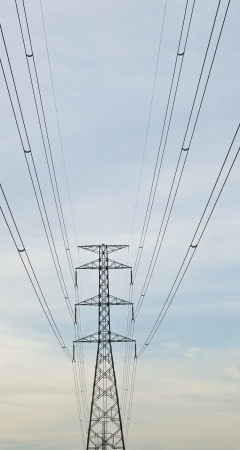 electric high voltage post with sky backgroundの写真素材
