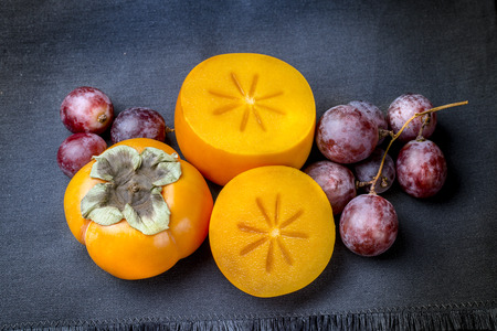 Kaki and grapesの写真素材