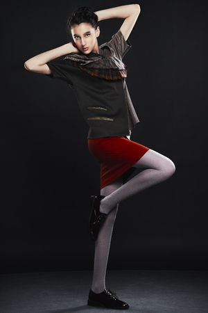 young woman in the studio on black backgroundの写真素材