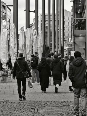 Pforzheim Germany Febtuat , Illustration in monochrome showing bustling city residents with umbrellasのeditorial素材