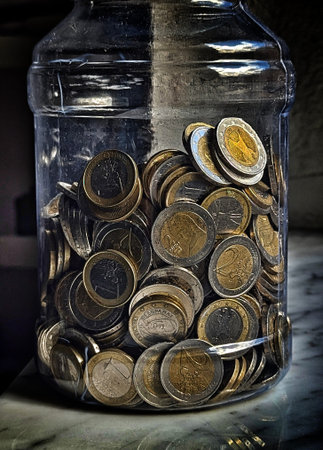 Pforzheim Germany February 25, 2026 Transparent Jar Stacked With Coins Donation Soft Shadow, Mixed...