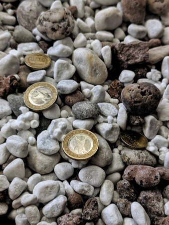 Coins Scattered On Pebbles, Rustic Outdoor Closeup Of Mixed Stones And Weathered Currency, Warm...