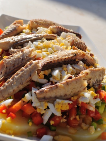Healthy, colorful and fresh salad, full of nutrients of all kinds. Main ingredients: mackerel, boiled eggs, pepper, potatoes and olive oilの写真素材