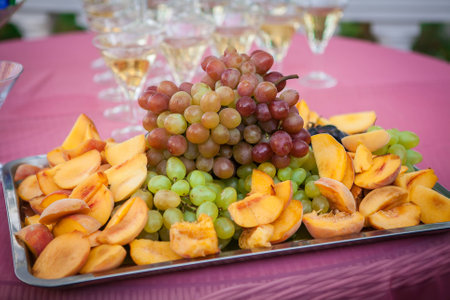 Fruits laid out on a tray in the restaurantの写真素材
