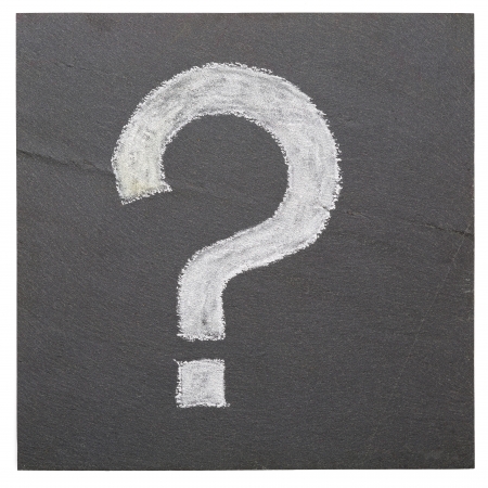 A question mark on a plate of slateの写真素材