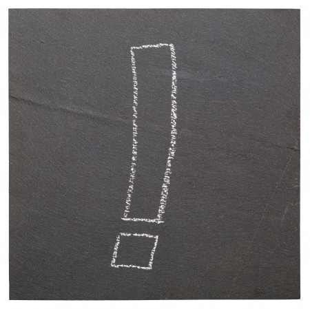 Exclamation mark on a plate of slateの写真素材