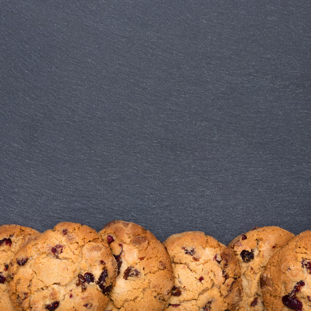A plate of slate with delicious cookies on it