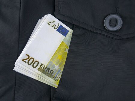 Euro money in a jacket pocket. Place for text.