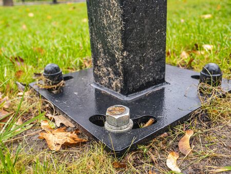The nut is screwed onto the bolt. Street post mount. Place for text.