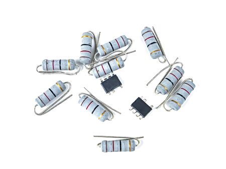 Electronic parts on a white background with place for text. Capacitor. Resistor. Chip. Transistor....