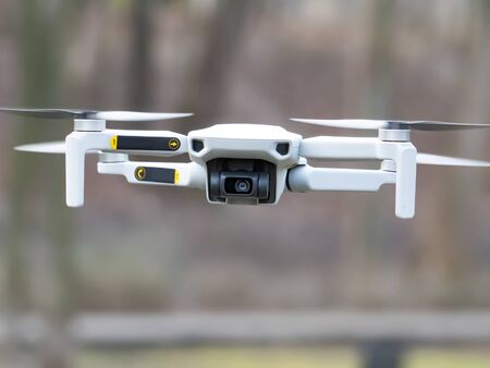Quadrocopter in flight in the air. Dron.Technology. Place for text. Background image.