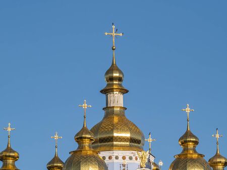 Cross on the dome of an Orthodox church in Kiev. Religion. Easter. Christmas. Place for text.
