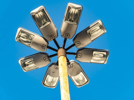 Street lights against the blue sky. Technology. Background image. Place for text.