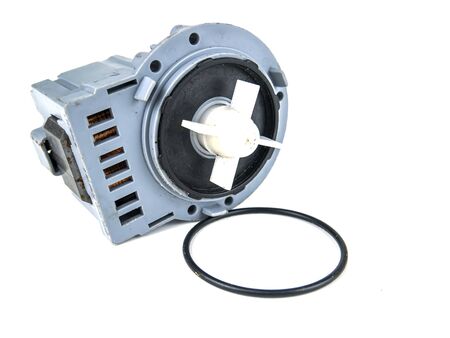 Motor pump with impeller of a washing machine on a white background. Repair of washing machines....
