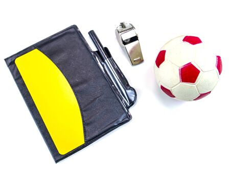 Soccer ball and yellow card with the whistle of a soccer referee on a white background. Football. Championship. World. Europe. Referee. Place for text.の写真素材
