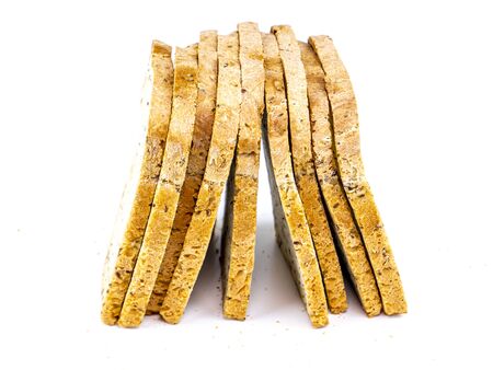 Sliced bread with flax seeds on a white background. Bread day. Kitchen. Place for text. Bakery...