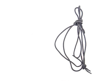 Shoelaces with a knot on a white background. Cord. Rope. Place for text. Background image.