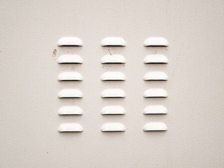 Texture of a white painted surface with air vents. Place for text. Template.