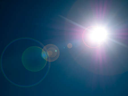 The sun on the background of a blue cloudless sky. Cloudy landscape. Nature. Space. Sunlight. Sun...