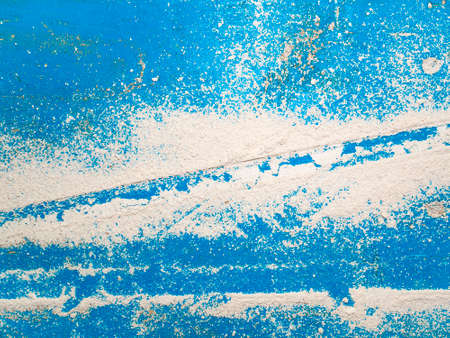 White chalk dust on a blue background. Background image. Place for text. Template. Poster. Building...