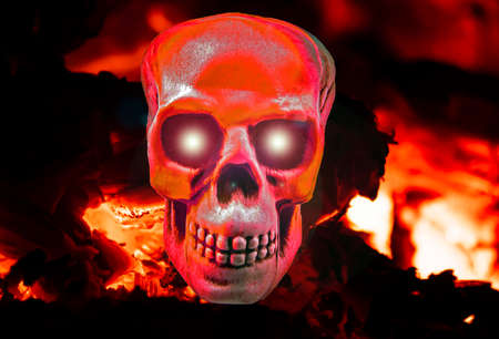 Human skull in the blazing fire of hell. Halloween holiday. All Saints' Day. Glittering eyes. Background image. Template with place for text. Background image. Poster. Magazine cover. Halloween party.の写真素材