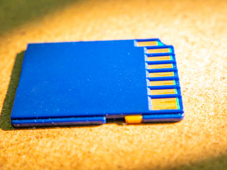 A closeup of a memory card lying on the table. Technology. Memory medium. Background image. Place...
