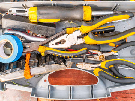 Plastic case with a working locksmith tool. Pliers and screwdrivers. Spanners. Electrical tape and...