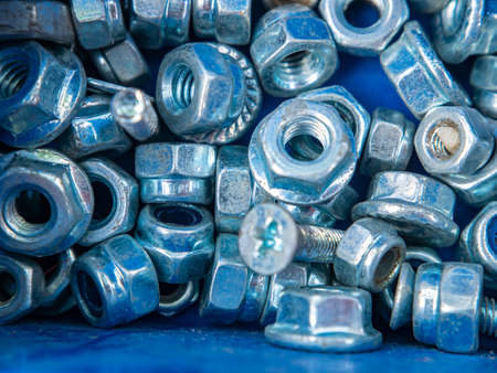 Threaded iron nut for screwing onto the bolt. Threaded connection of parts with a bolt and a nut....