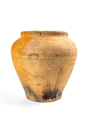 Ceramic clay jug on a white background. Old kitchen utensils. Handmade clay jug. White background. Background image. Place for text.の写真素材