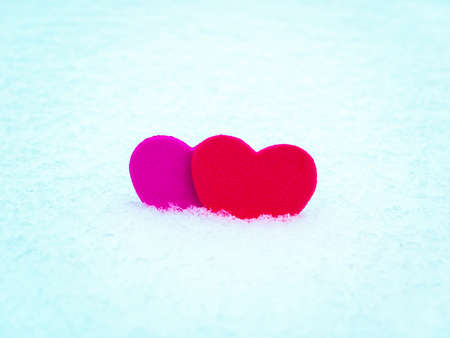 Valentine red heart symbol on white snow. Valentine's Day. Red valentine. Heart symbol. Day of Love. Feast in February. Valentine's day holiday. Fate. Engagement. Wedding. Greeting card.の写真素材