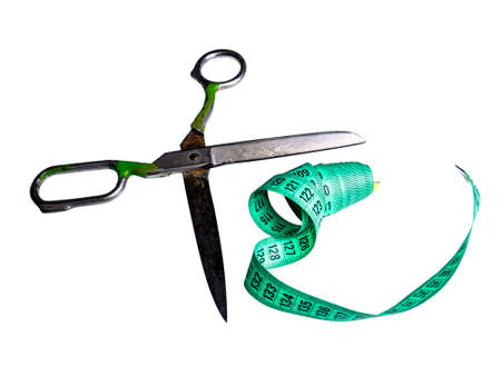 Tailors hand tool for tailoring scissors and centimeter. Centimeter gauge. Meter ruler. Measurement of the size of the clothes. Tailor's tool. Clothing sewing and repair. White background.の写真素材