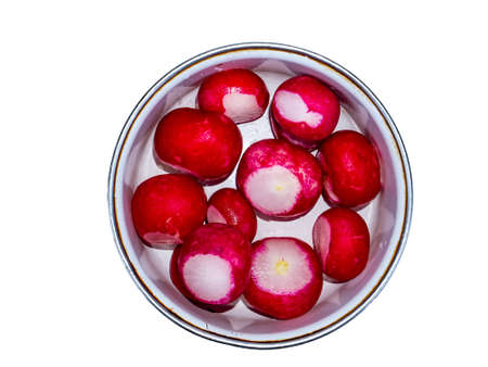 Red radish vegetable in a plate on a white background. Red radish. Vegetable food. Vegetarian food. Iron plate. Kitchenware. White background. Agricultural products. Fresh vitamins.の写真素材