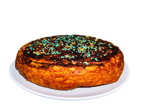 Round dough pie decorated with colored pastry sprinkles. Dough cake. Sweet dessert. Homemade baking....