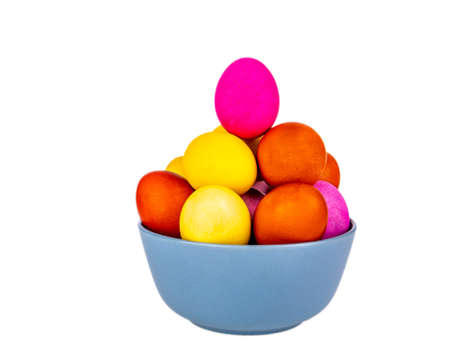 Colored Easter eggs in a plate on a white background. Easter egg. Christian tradition. Religion and culture. Chicken eggs. Spring holiday. Chicken egg. Festive food. White background. Beauty.の写真素材