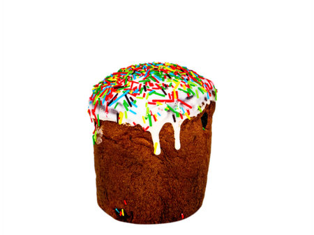 Easter bread with colored glaze on a white background. Easter bread artos. Orthodox Church. Religious tradition. Religious Christian holiday. Dough baked goods. Festive food. Resurrection.の写真素材