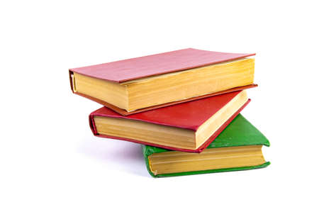 A stack of old books with colored covers. Books for reading. Old book. Book page of yellow paper....