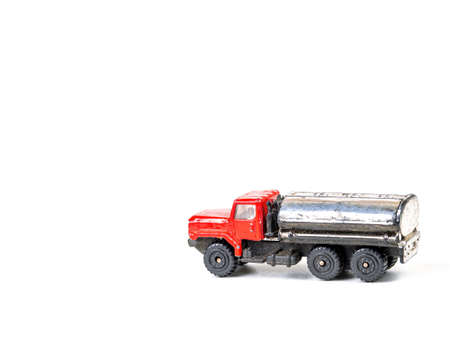 Truck with a tank - a childrens toy on a white background.の写真素材