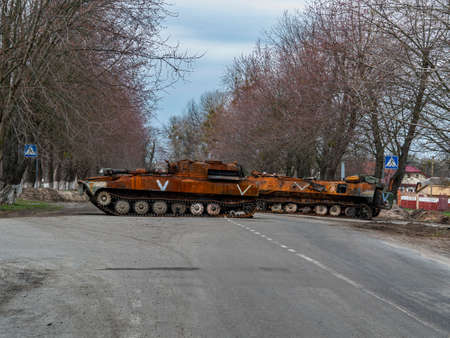 War in Ukraine. Armored vehicles of the Russian army on the streets of Ukraine. Military tanks and...