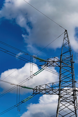 High-voltage power transmission tower with wires.