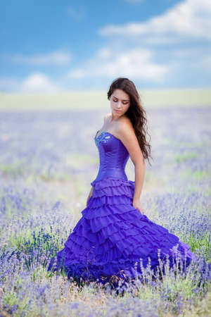 Series. Portrait of beautiful romantic woman in fairy field of lavender の写真素材