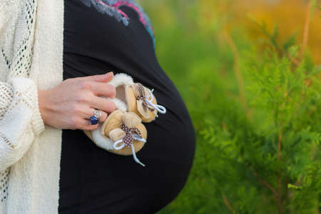 Pregnant belly closeup. New life concept. Copy space for text.の写真素材