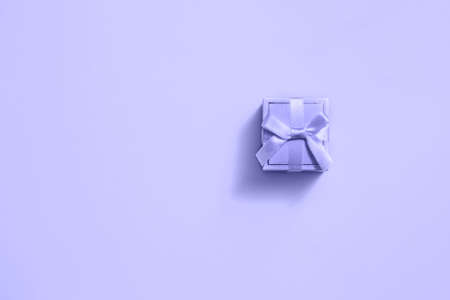Trendy color of year 2022 Very Peri. Violet gift box on trendy color background. Trendy color background.の写真素材