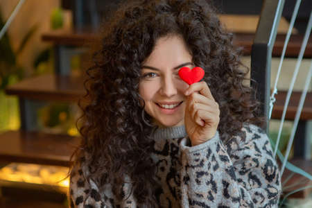 Beautiful joyful woman expressing positive emotions. Valentines Day gift.の写真素材