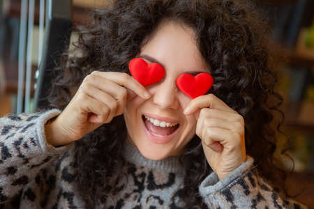 Beautiful joyful woman expressing positive emotions. Valentines Day gift.の写真素材