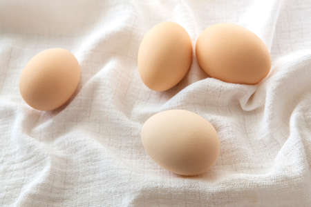 Chicken eggs on white background, selective focus. Happy easter background.の写真素材